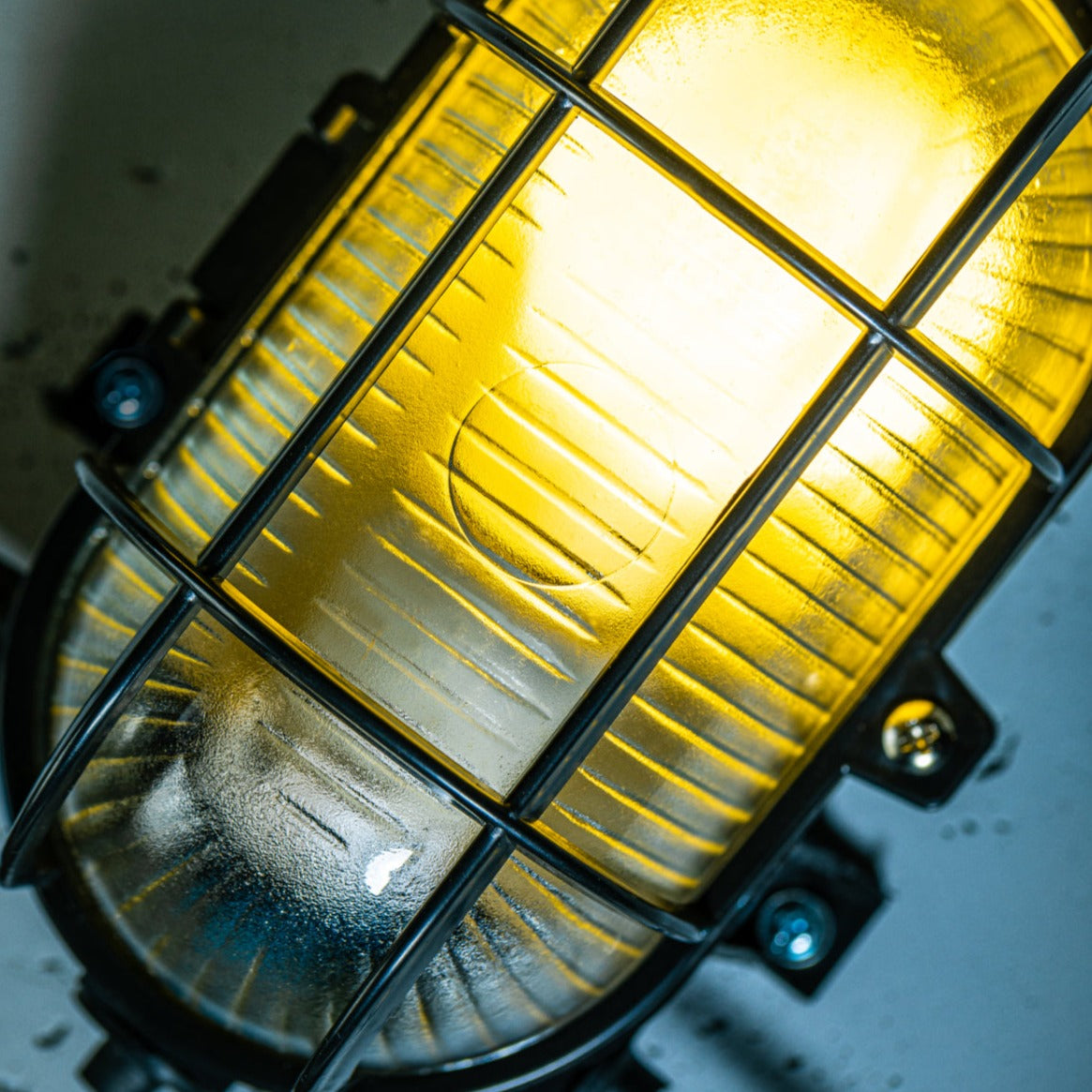 Our industrial style caged outdoor cage light is made from a high-quality polycarbonate body which is weather and rust proof and is complete with a prismatic glass diffuser and protective cage.