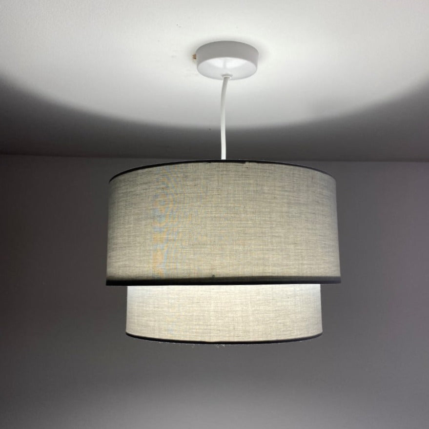 Our Kimber easy fit two tiered luxury fabric double layered shade is contemporary in its appearance and we have designed the shade to suit a range of interiors. Easy to fit simply attached to an existing pendant flitting.  It is crafted from high quality fabric material in two layers and complimented with a white inner.