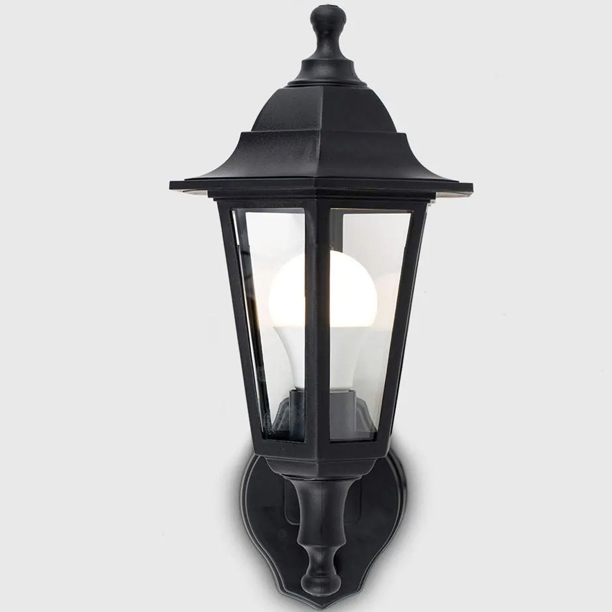  Traditional Vintage Coach Lantern design outdoor wall light with a built in motion sensor perfect for adding style and security  Our traditional front-door lantern in the form of our Adele Wall Light has the look of the traditional coach with the design to last. Made from durable rust proof polycarbonate body in matt black and constructed with fitted glass windows to show the bulb this is sure to add an statement to any wall 