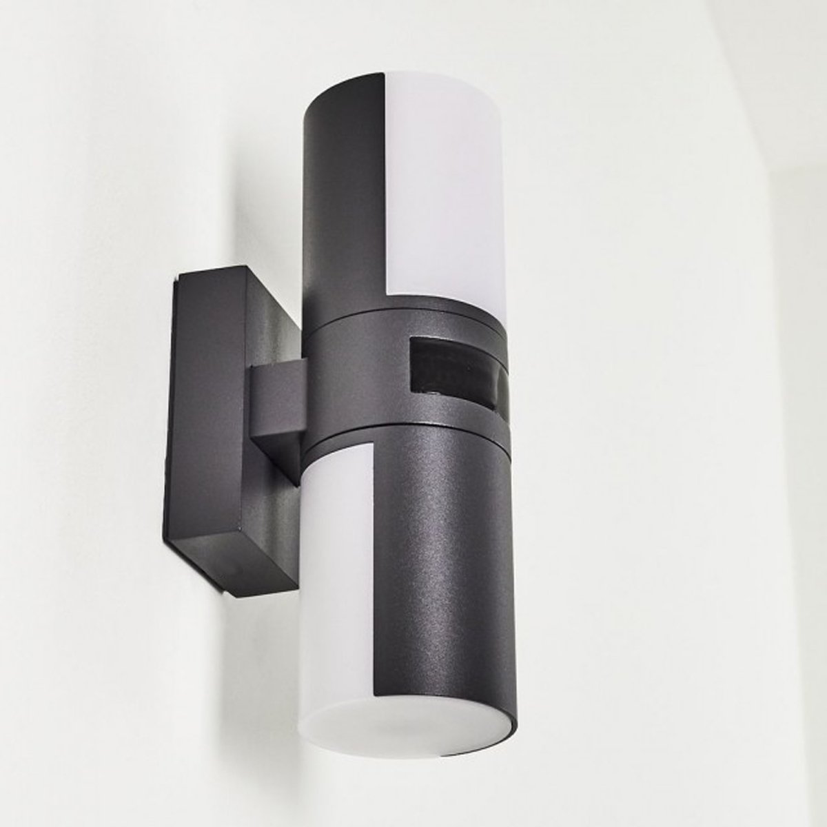 Our Faith dark grey anthracite outdoor wall mounted cylinder light would look perfect in a modern or more traditional home design. Outside wall lights can provide atmospheric light in your garden, at the front door or on the terrace as well as a great security solution. It is designed for durability and longevity with its robust material producing a fully weatherproof and water resistant light fitting.