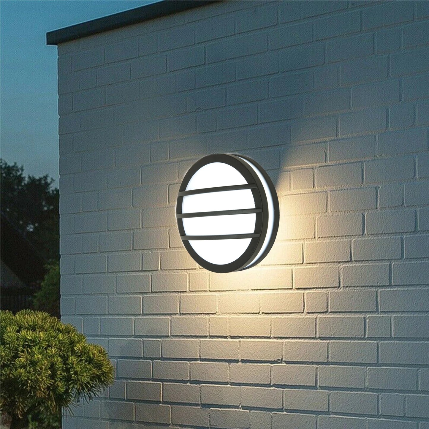 Our Hallie dark grey aluminium wall mounted round outdoor light with built in LED's would look perfect in a modern or more traditional home design. Outside wall lights can provide atmospheric light in your garden, at the front door or on the terrace as well as a great security solution. It is designed for durability and longevity with its robust material producing a fully weatherproof and water resistant light fitting.
