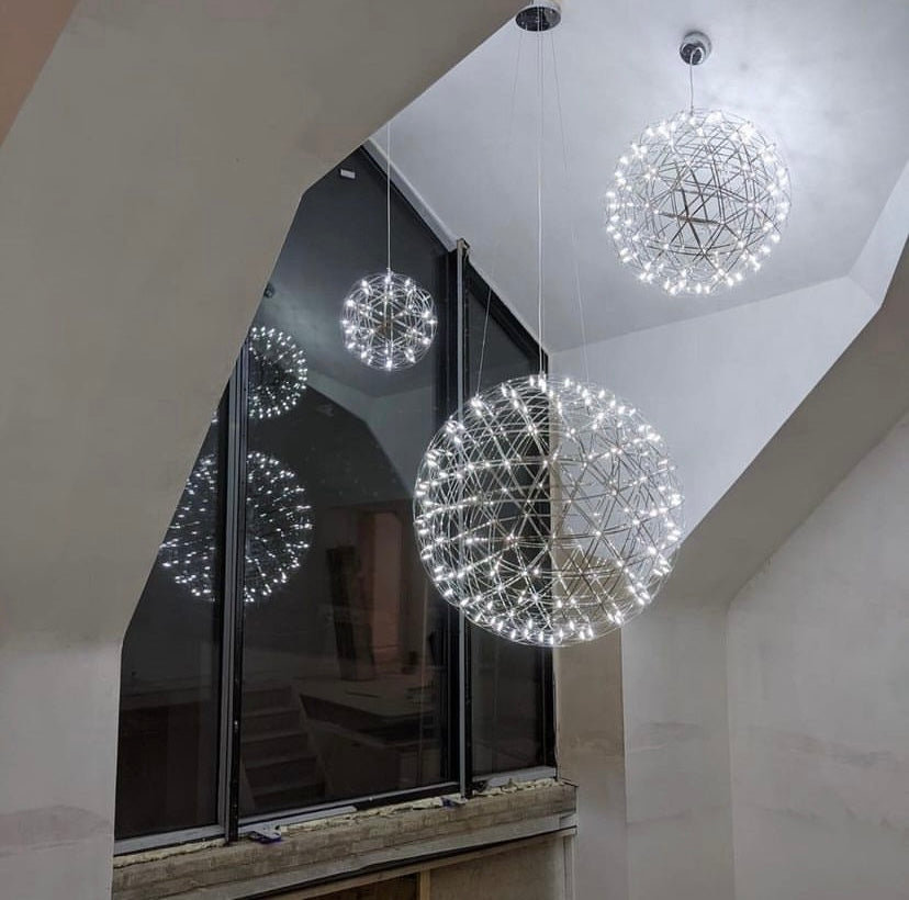  Our striking 40cm large silver starburst light is the perfect way to make a statement with your interiors. It is inspired by elements of the night sky, comprising of a delicately crafted stainless steel round spherical shape and perfectly finished in LED lights  This LED starburst sparkle pendant light will create a talking point in any space and can be placed together with the other size starburst lights to create something truly spectacular