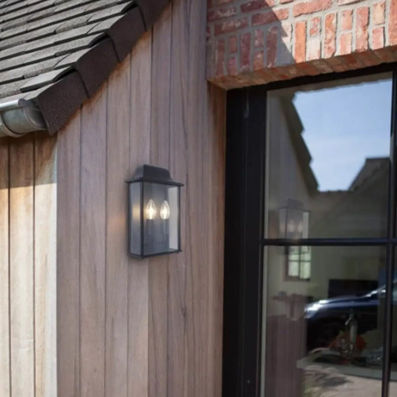 If you’re looking for a modern take on a traditional outdoor wall light, this glass box lantern wall light is perfect for adding style and protection for your home. This classic lantern light is designed with a contemporary twist, styled with a rectangle shape and fitted with glass windows that allow the light to shine effectively. 