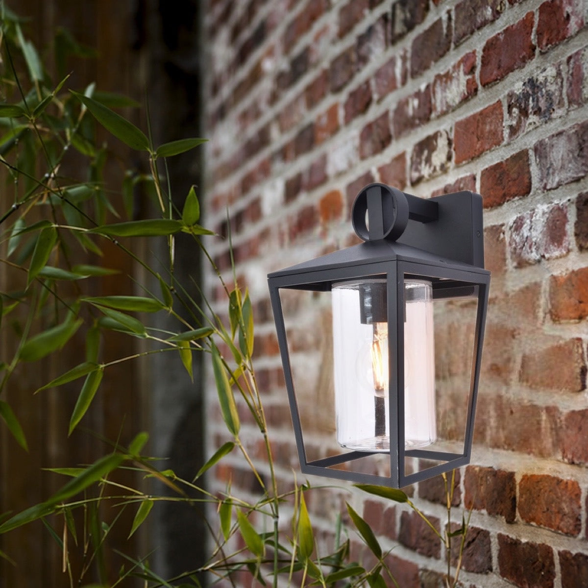 A modern take on a traditional design outdoor wall light perfect for adding style and security The traditional front-door lantern has had a modern make over in the form of our Myla  wall light with its combination of a cylinder glass diffuser and black heavy duty aluminum this is sure to add an statement to any wall