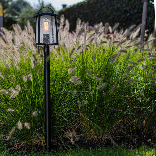 Our stylish outdoor lantern post light is made from a high-quality fully weather and rust proof black metal material and is complimented with a clear glass wet look diffuser. The modern and contemporary design would suit modern and traditional homes.