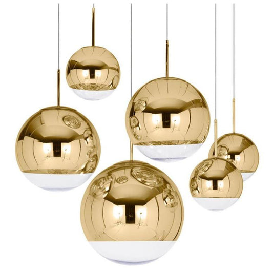  Our striking Golden globe ceiling light is the perfect way to make a statement with your interiors. It is inspired by elements of the night sky, comprising of a delicately crafted gold and frosted round shade and comes complete with a matching gold ceiling rose.  This unique pendant light will create a talking point in any space and can be placed together at different heights to create something truly spectacular
