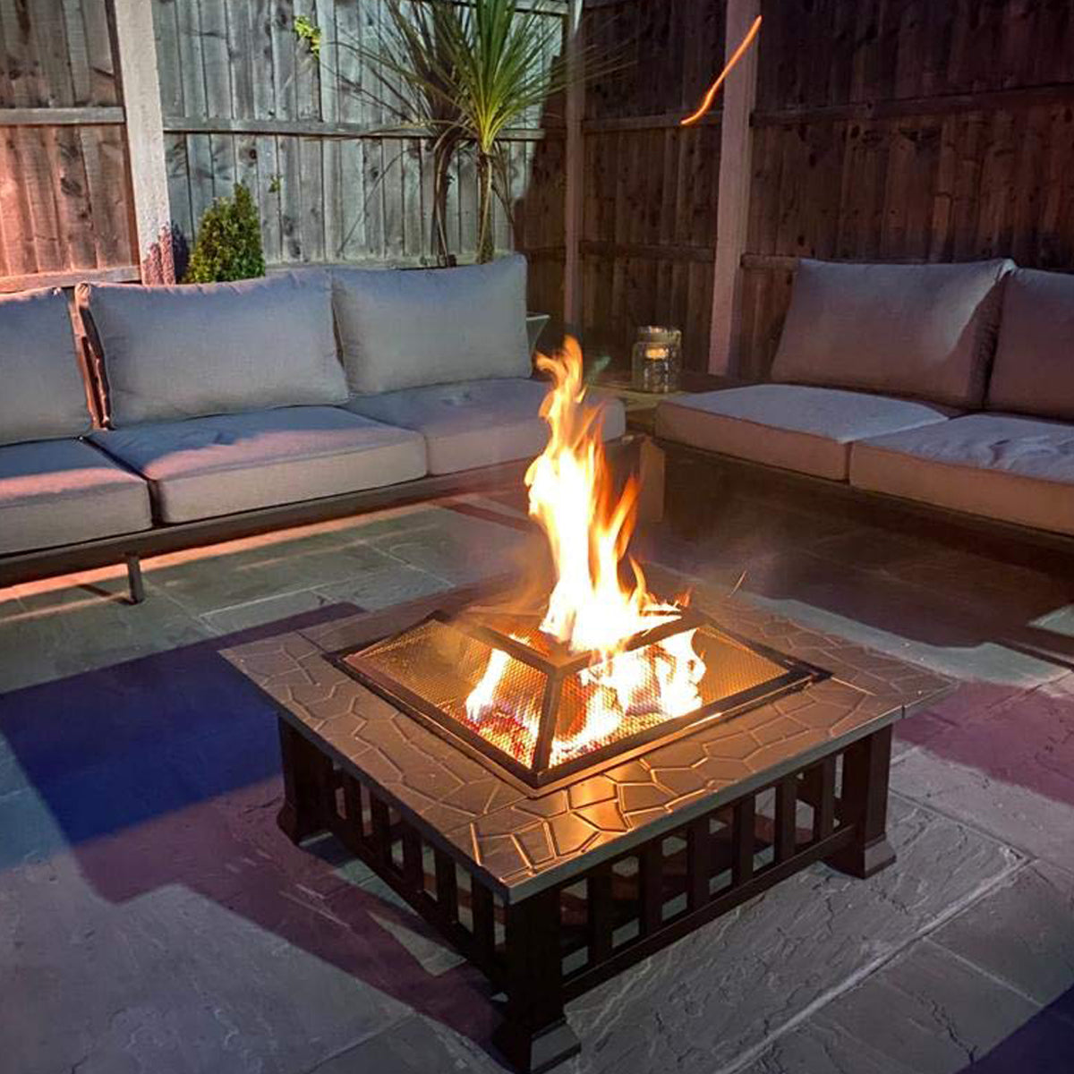 Our CYNTHIA Large Luxury Square Fire Pit / Patio Heater / BBQ / Ice Box is sure to provide warmth and comfort on cool evenings. This robust design ensures its suitability for any type of non flammable surface and is accompanied by a safety mesh lid, helping to prevent any burning embers from blowing away