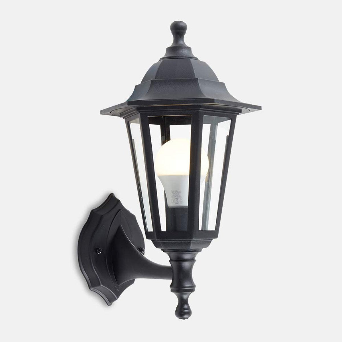 Our Orla black wall mounted traditional outdoor wall lantern light would look perfect in a modern or more traditional home design. Outside wall lights can provide atmospheric light in your garden, at the front door or on the terrace as well as a great security solution. It is designed for durability and longevity with its robust material producing a fully weatherproof and water resistant light fitting.