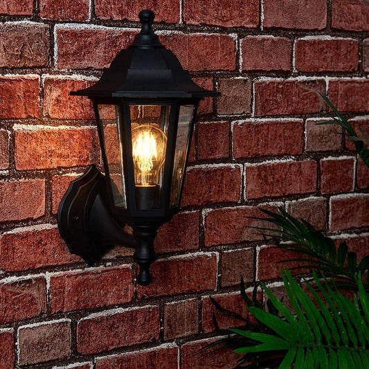 Our Orla black wall mounted traditional outdoor wall lantern light would look perfect in a modern or more traditional home design. Outside wall lights can provide atmospheric light in your garden, at the front door or on the terrace as well as a great security solution. It is designed for durability and longevity with its robust material producing a fully weatherproof and water resistant light fitting.