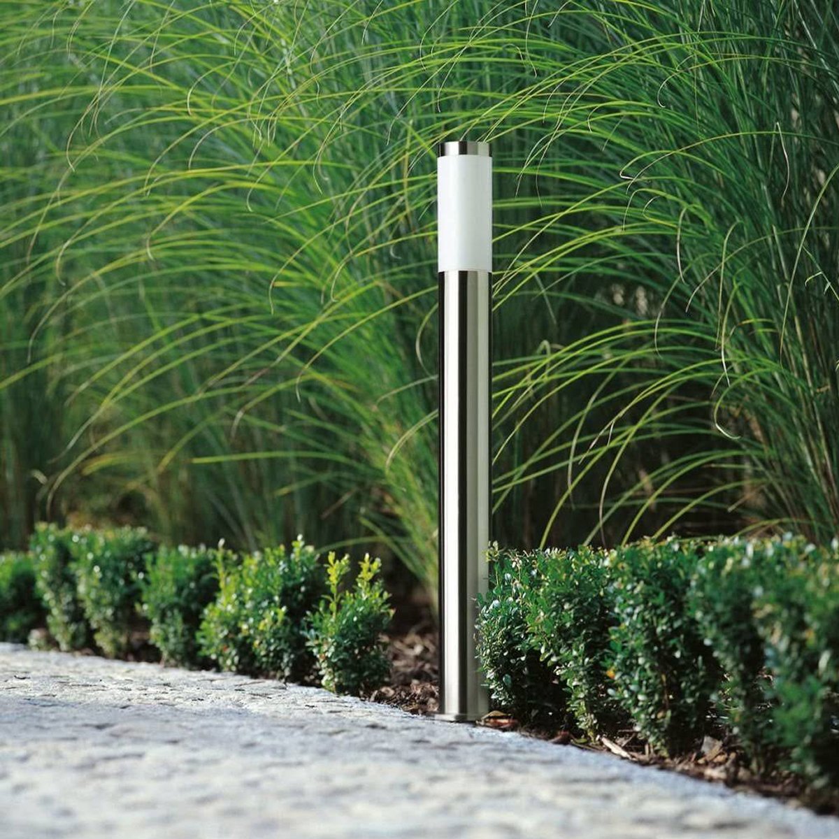 The ASTER 1M post light is the perfect addition to modern outdoor areas. It features a sleek, round design with a stainless-steel body and an opal polycarbonate diffuser. Ideal for gardens, driveways, workspaces, pubs, and hotels, this post light offers both illumination and security.