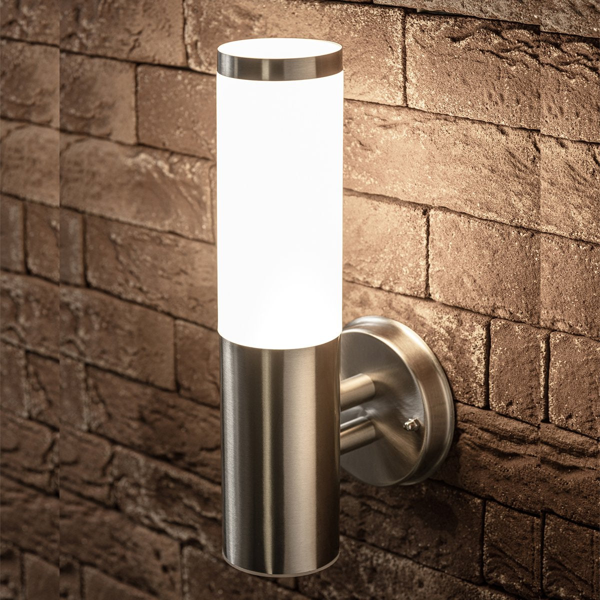 Our Aster wall light looks great in modern settings. Our wall light has a simple round design, and its stainless-steel body is complemented by an opal polycarbonate diffuser. This wall light is perfect for any outdoor space requiring light and security such as gardens, driveways, doorways workspaces, pubs and hotels.