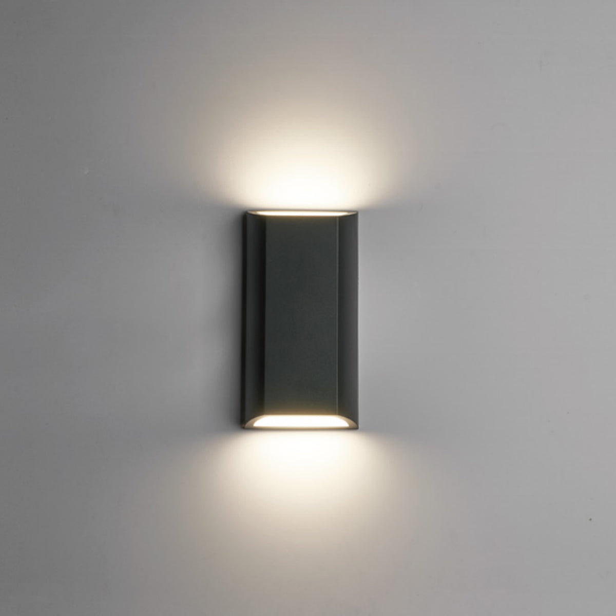 clear quality image of our WILMA dark grey rectangular wall light switched on showing white light on top and bottom applied to grey wall