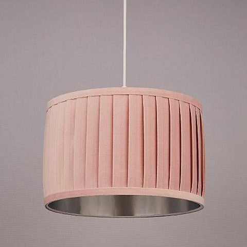 Our pink Harper luxury velvet pleated shade is glamorous in appearance and we have designed the shade to suit a range of interiors. Easy to fit, it’s crafted from high-quality pink velvet complimented with a silver reflective inner. It's made to fit both a ceiling light or lamp base.