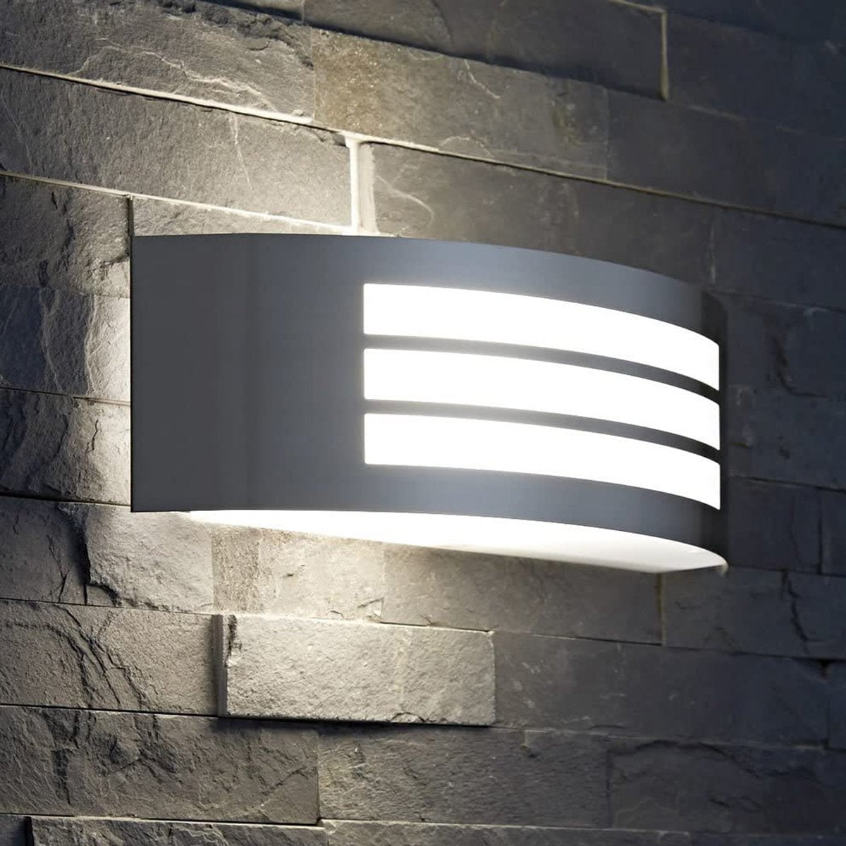 Stylish Striker with a shade made of polycarbonate is a hemispherical outdoor lamp holder, made of stainless steel, decorated with additional, narrower stripes. The surface distributes the light of the lamp softly and evenly, creating an atmospheric, pleasant light even outdoors.