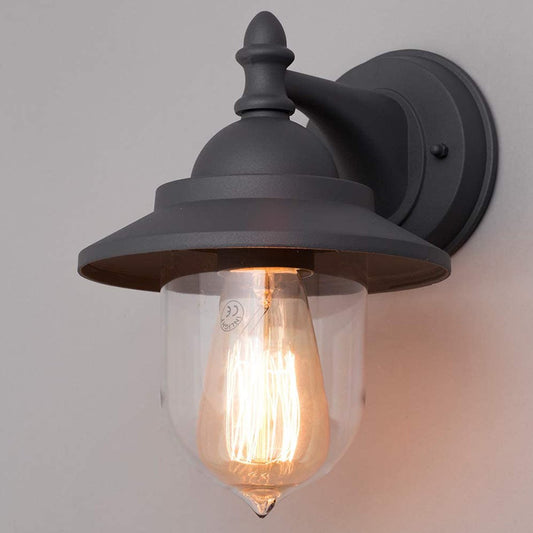 High quality image of dark grey fisherman lantern light fixed to the white wall while turned on