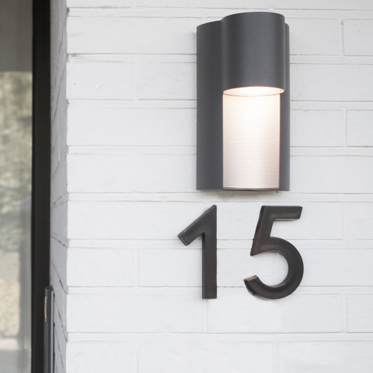 Our Gemma dark grey outdoor curved wall light would look perfect in a modern or more traditional home design. Outside wall lights can provide atmospheric light in your garden, at the front door or on the terrace as well as a great security solution. It is designed for durability and longevity with its robust material producing a fully weatherproof and water resistant light fitting. Use LED bulbs to make this light energy efficient and low cost to run