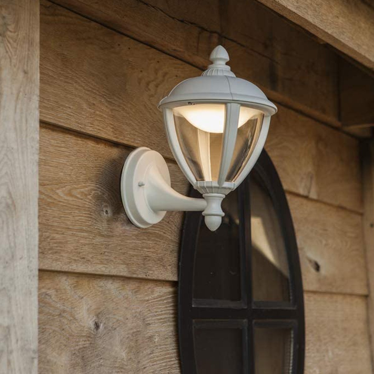 Our Cindy lantern wall light delivers on style and durability and is a smart choice for your exterior lighting. With its white aluminium construction teamed with clear panes, this lantern is hardwearing and rust and weatherproof. Built for life outdoors, it has an IP44 rating which means it can withstand the harshest of weather conditions. For sophisticated yet robust outdoor lighting, our Cindy white outdoor traditional lantern is a strong contender.