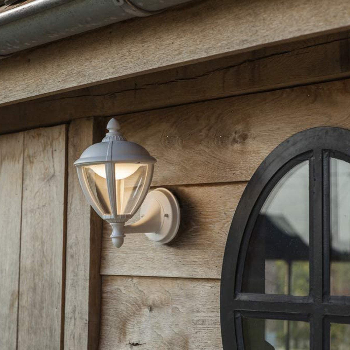 Our Cindy lantern wall light delivers on style and durability and is a smart choice for your exterior lighting. With its white aluminium construction teamed with clear panes, this lantern is hardwearing and rust and weatherproof. Built for life outdoors, it has an IP44 rating which means it can withstand the harshest of weather conditions. For sophisticated yet robust outdoor lighting, our Cindy white outdoor traditional lantern is a strong contender.