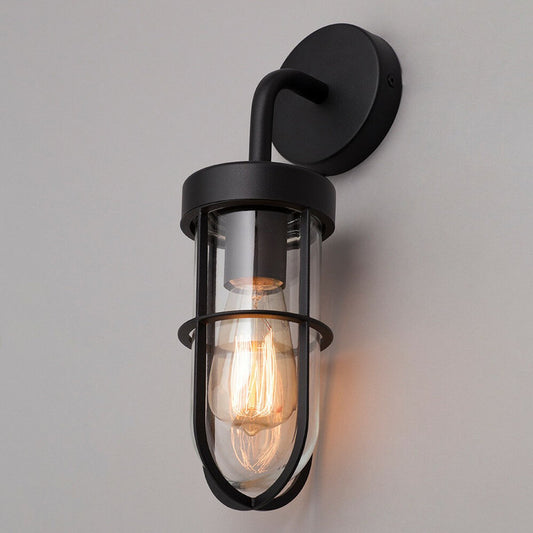 This wall lantern light is styled with a sophisticated black and glass colour scheme, allowing the wall light to fit into any home’s style. What’s more, the lantern’s design is a modern take on a traditional styled wall light, creating a flexible look for interior and exterior use. The addition of the glass shade adds an eloquent appearance when affixed to the wall, ensuring that your home’s looks are not disturbed by our premium wall lantern light.