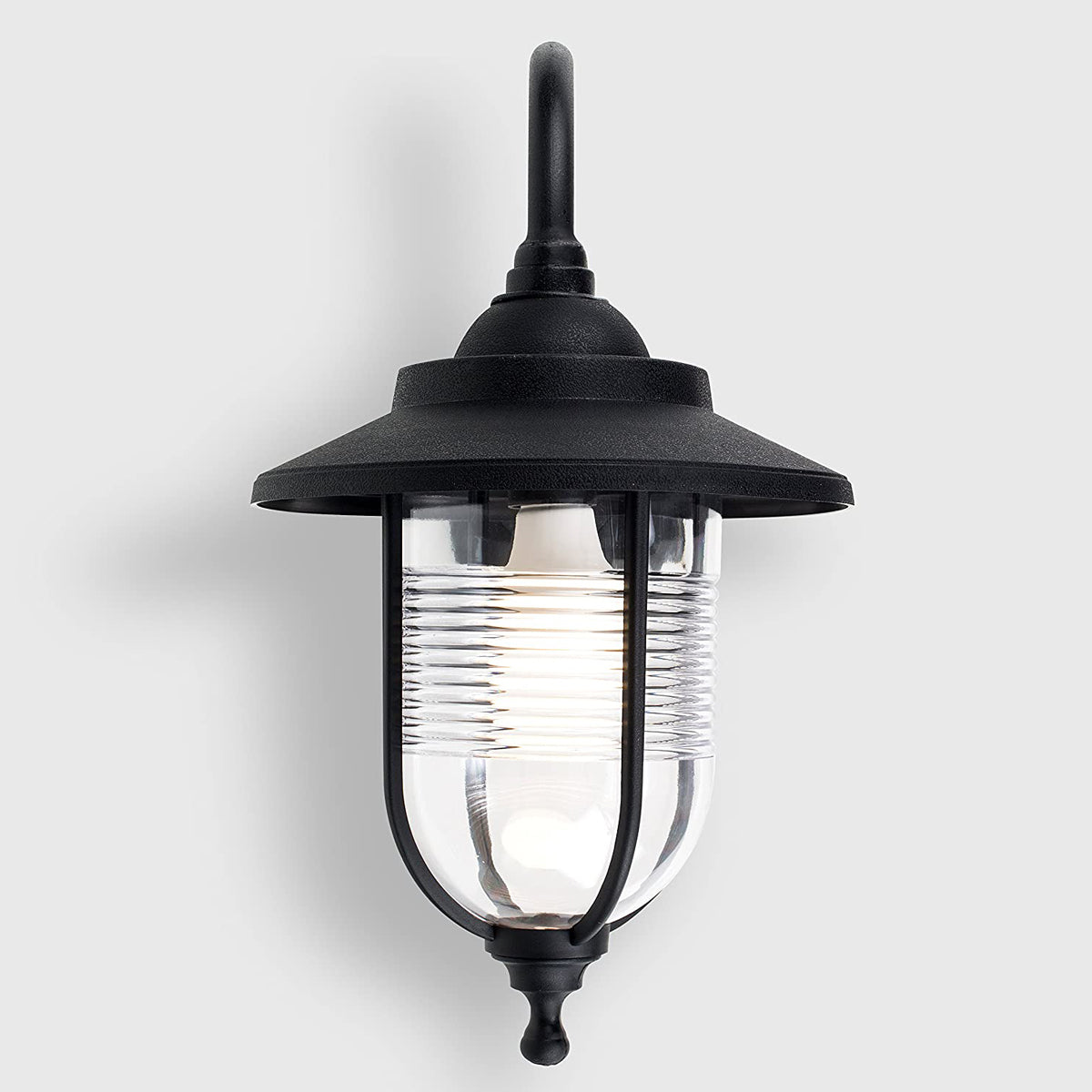 The Evelyn black fisherman hooked outdoor wall lantern light is constructed of a black weatherproof metal and features an attractive design inspired by traditional lighting styles. This lantern wall light is a great choice for illuminating doorways, porches wall or patios, creating a warm and inviting look and a safe environment. With an IP44 safety rating, the Evelyn wall light is suitable for mounting on outdoor walls.