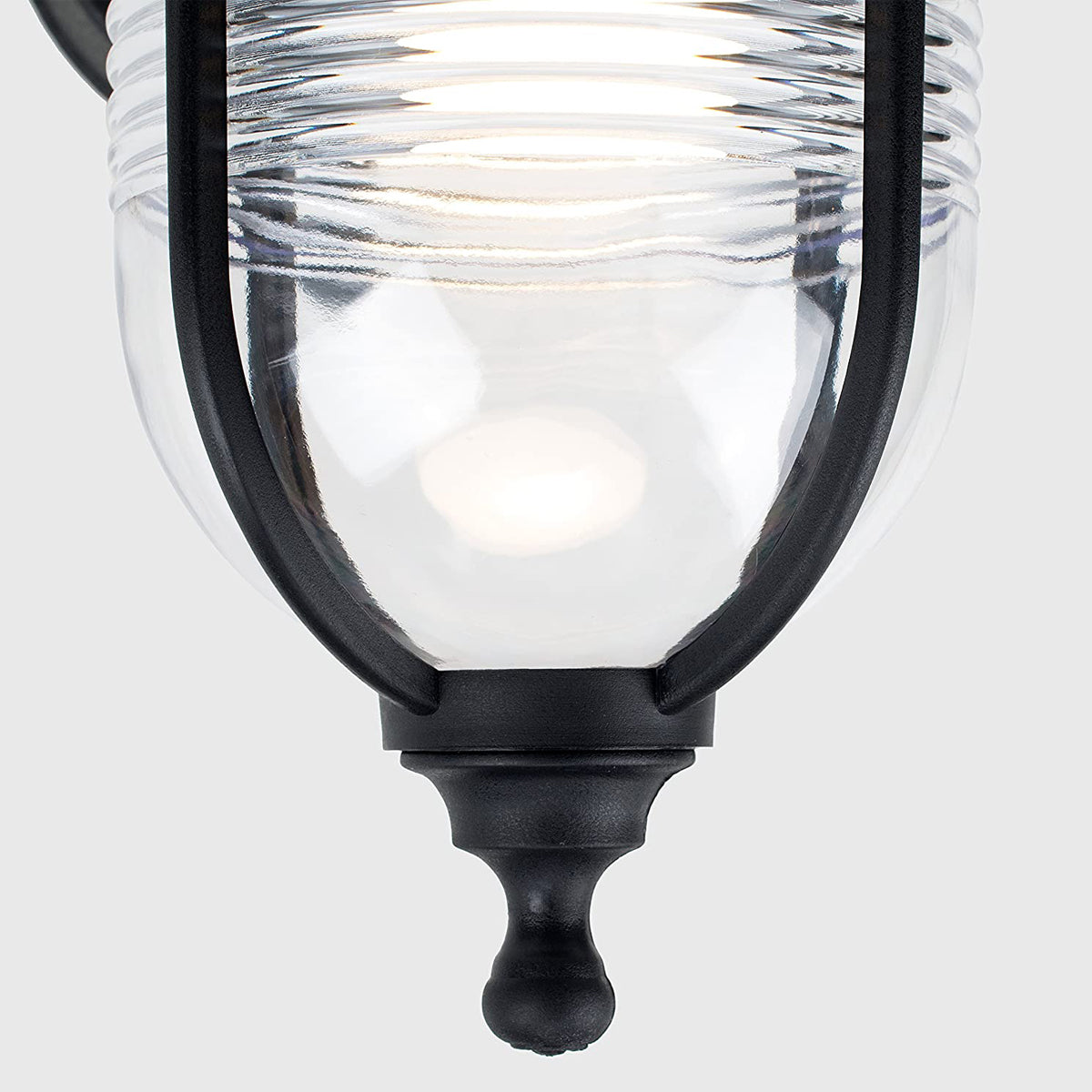The Evelyn black fisherman hooked outdoor wall lantern light is constructed of a black weatherproof metal and features an attractive design inspired by traditional lighting styles. This lantern wall light is a great choice for illuminating doorways, porches wall or patios, creating a warm and inviting look and a safe environment. With an IP44 safety rating, the Evelyn wall light is suitable for mounting on outdoor walls.