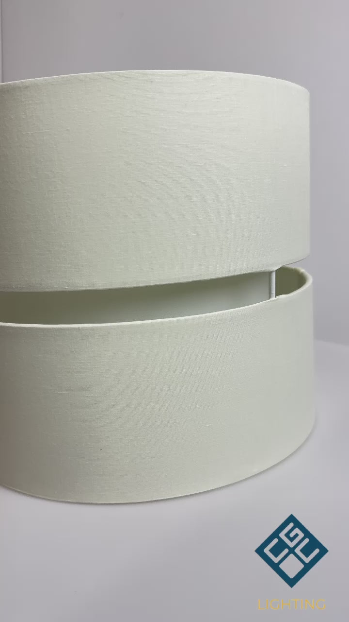 Our Gayle easy fit two tiered luxury fabric double layered shade is contemporary in its appearance and we have designed the shade to suit a range of interiors. Easy to fit simply attached to an existing pendant flitting.  It is crafted from high quality fabric material in two layers and complimented with a matching inner which looks beautiful when light shines through. The shade has been made to fit both a ceiling light or lamp base.