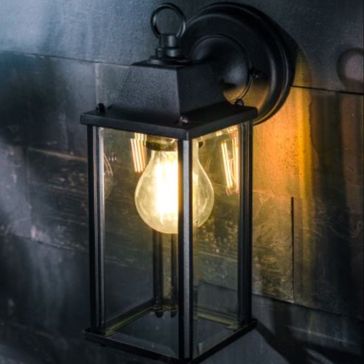 If you’re looking for a modern take on a traditional outdoor wall light, this glass coach wall light is perfect for adding style and protection for your home. This classic lantern light is designed with a contemporary twist, styled with a cuboid shape and fitted with glass windows that allow the light to shine effectively. 