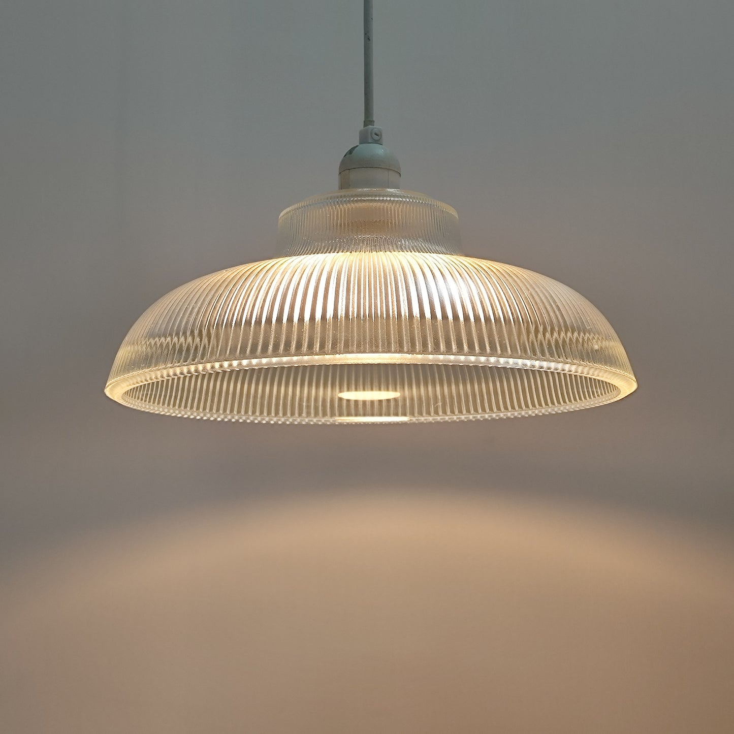 Glass lighting has proven very popular in the lighting sector, and we are extremely happy to introduce the Jacinta to our range. Our ribbed glass easy fit light pendant is a very attractive light fitting and easy fit means you can give your room a makeover by simply attaching it to an existing light fitting. 