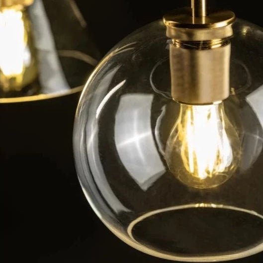 Our Cree pendant light is a stylish addition suitable for every room, its  gold  glass globe body with matching gold ceiling rose and cable creates an amazing feature on any ceiling and gives a golden finish that warms up the room. The lamp looks great with a filament light bulb, especially in industrial and modern interiors