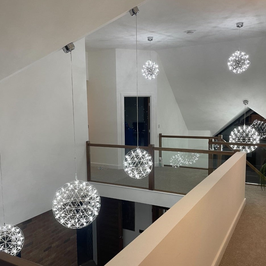  Our striking 40cm large silver starburst light is the perfect way to make a statement with your interiors. It is inspired by elements of the night sky, comprising of a delicately crafted stainless steel round spherical shape and perfectly finished in LED lights  This LED starburst sparkle pendant light will create a talking point in any space and can be placed together with the other size starburst lights to create something truly spectacular