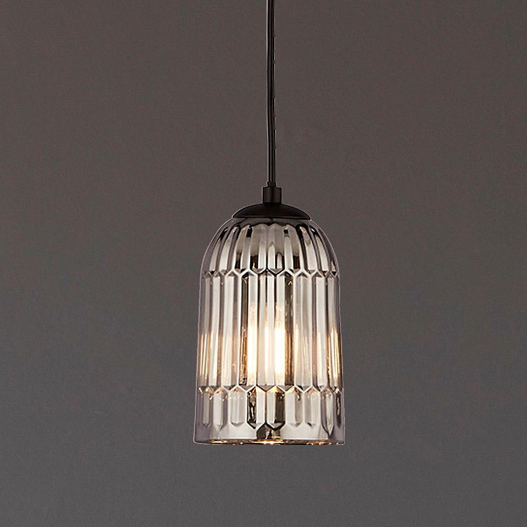 Smokey glass is the perfect material if you want to create a tranquil environment. The subtle glow of the bulb shines our through the ridged shade which is hung from a round metal ceiling mount. Weather you're wanting a warm welcome home in the hall or looking to light a living room or dressing room this is the perfect home accessory.